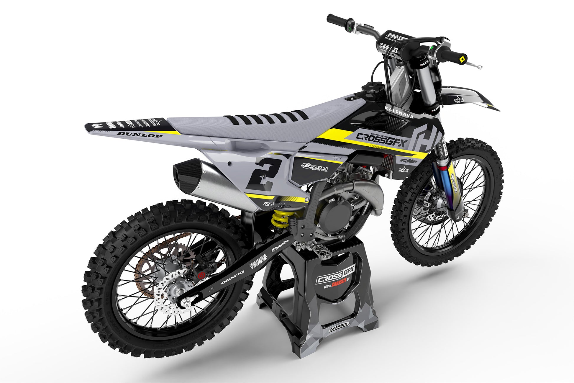 Rear view of the Xcel Black racing graphics kit on a Husqvarna dirt bike.