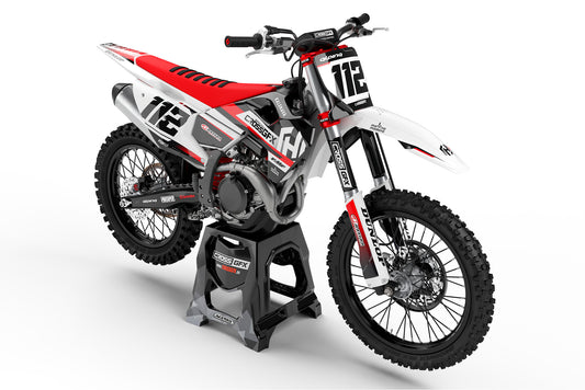 Front view of the Xcel Red graphics kit on a Husqvarna motocross bike.