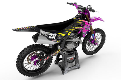 Rear view of the Flame Purple graphics kit on a Kawasaki dirt bike.