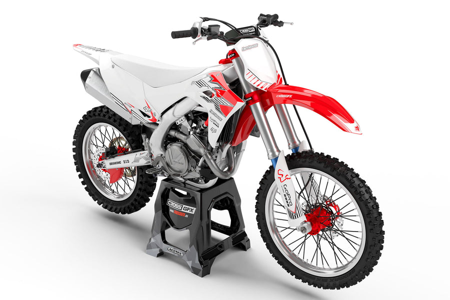 Front view of the PEAK White graphics kit for a Kawasaki motocross bike.