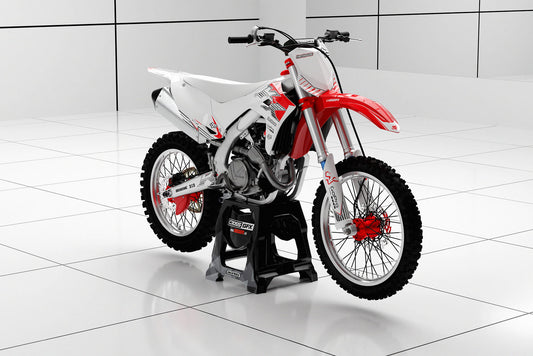 Promotional image of the PEAK White graphics kit for a Kawasaki motocross bike.