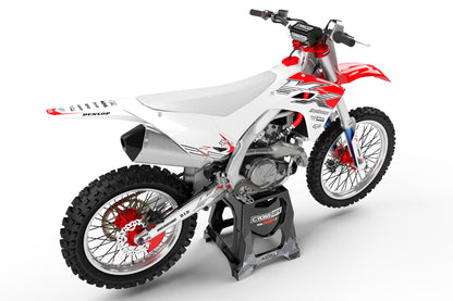 Rear view of the PEAK White graphics kit on a Kawasaki dirt bike.