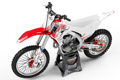 Left side view of the PEAK White graphics kit for a Kawasaki motocross bike.