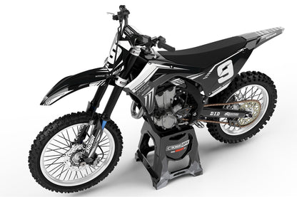 Left side view of the SHIFT Black graphics kit for a Kawasaki motocross bike.