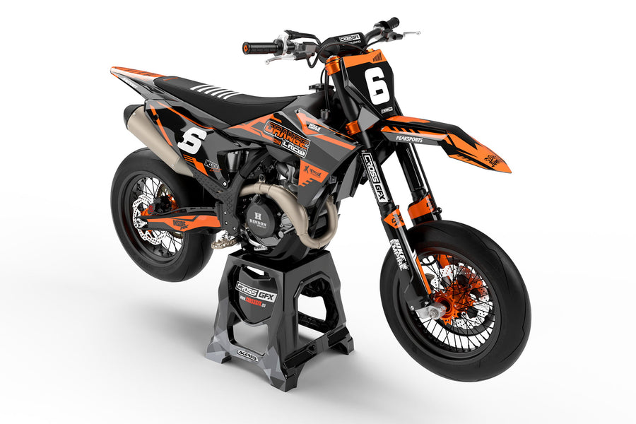 Front view of the Volt Orange graphics kit on a KTM motocross bike.