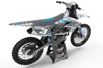 Rear tail view of the Apache Blue racing graphics kit on a Yamaha dirt bike.